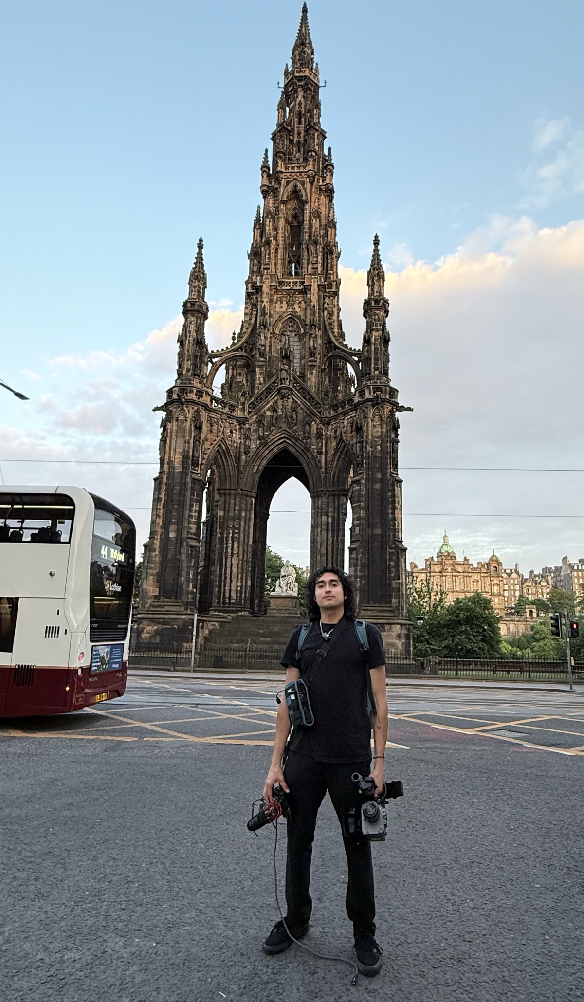 Mathew Diaz, camera rigs in hand, in front of the Scott Monument in Edinburgh